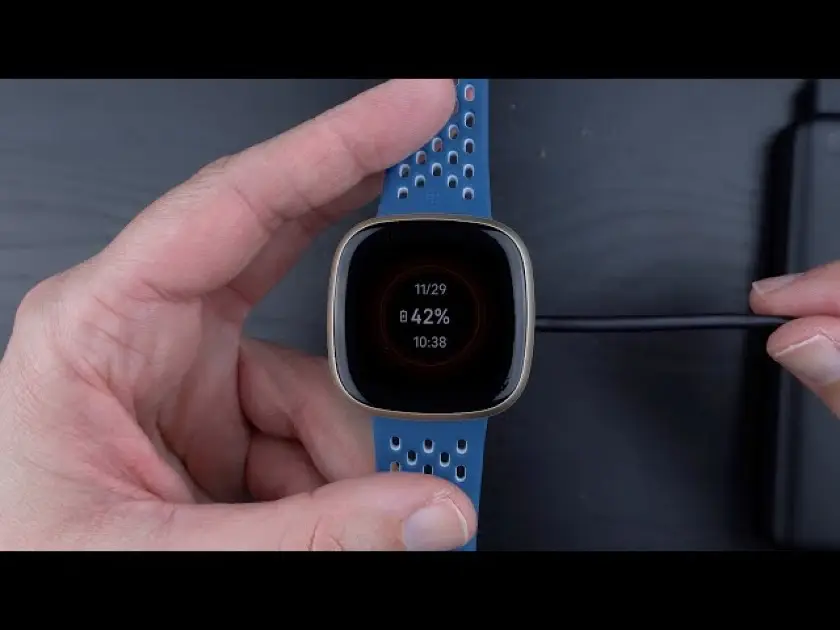 Fitbit Sense 2 smartwatch displaying battery life percentage on screen.