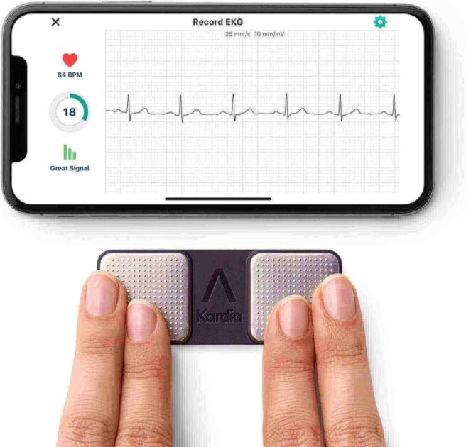 User performing ECG test with fingers on KardiaMobile 6L