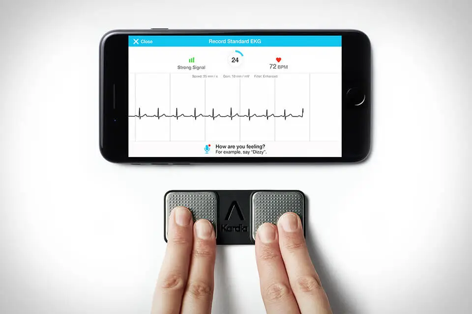 Person using KardiaMobile 6L device to take a six-lead ECG on a smartphone