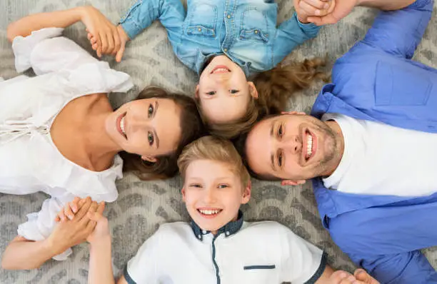 Smiling, empowered family, symbolizing health, mindset, and transformation with MF Healthy Living.