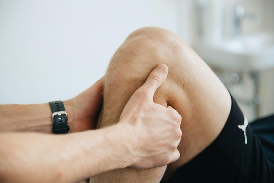 Close-up of hands applying acupressure to relieve joint pain