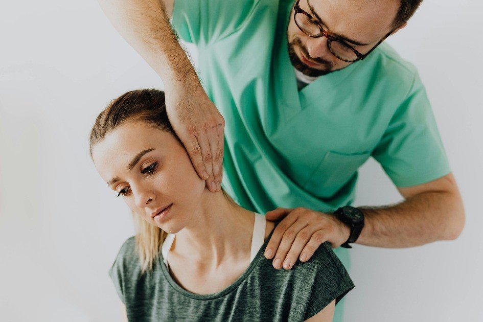Person using fingers to apply acupressure to neck, relieving tension naturally.