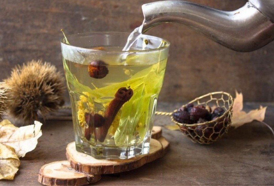 Refreshing Ayurvedic herbal infusion in glass, promoting hydration and wellness