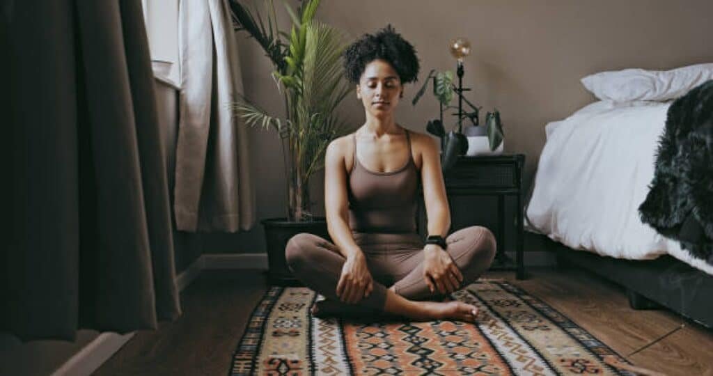 Serene woman meditating, embodying Ayurvedic mind-body balance