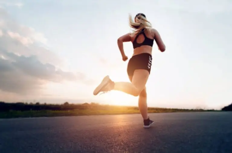 Runner sprinting at sunrise, symbolizing boosted cardio fitness