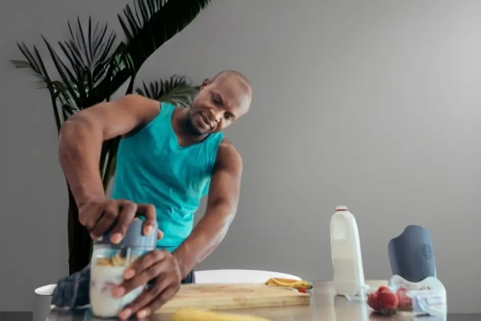 Athlete preparing a healthy meal to fuel a cardio workout, showcasing nutritious foods like fruits, vegetables, and lean proteins