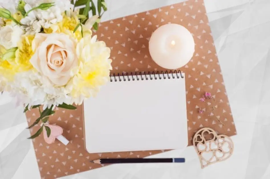 Open journal with handwritten notes, surrounded by calming candles and greenery, symbolizing mindfulness and self-reflection.