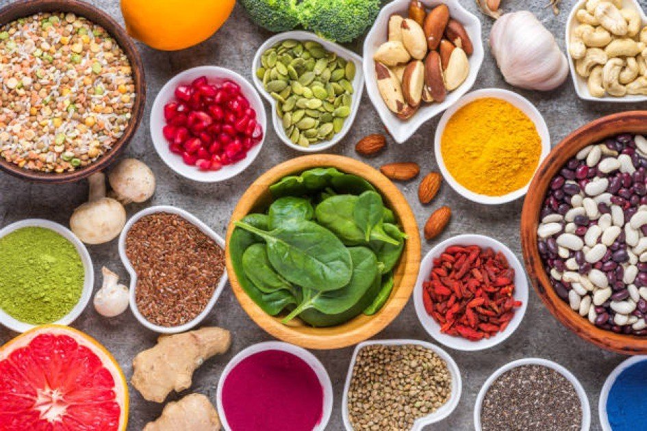 Colorful spread of nutrient-dense superfoods representing holistic health.