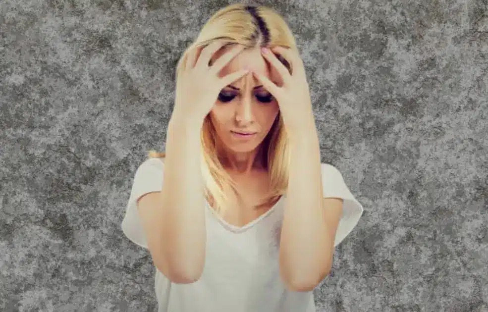 Illustration of a person surrounded by floating hormone symbols, depicting emotional distress.