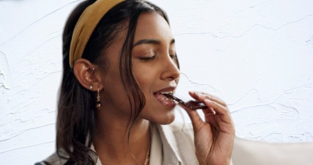 Indulging in dark chocolate during intermittent fasting, balancing health and cravings.