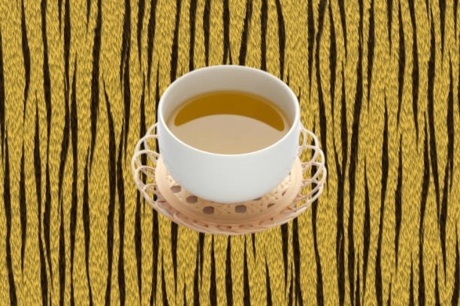 Green tea in a cup with a clean background, symbolizing intermittent fasting benefits.