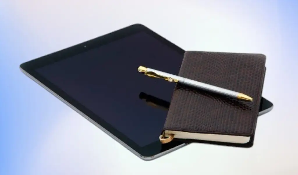 A side-by-side comparison of a journal and a tablet.