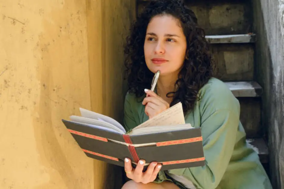 Person journaling with mindfulness and meditation for clarity and insight