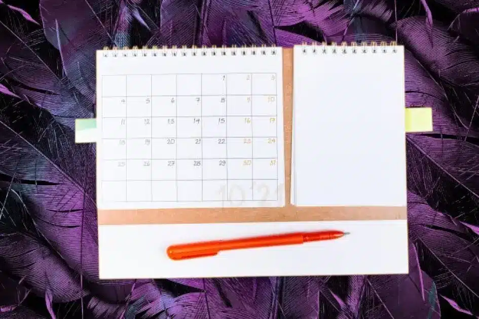 Open journal with colorful mood tracker chart and a calming background.