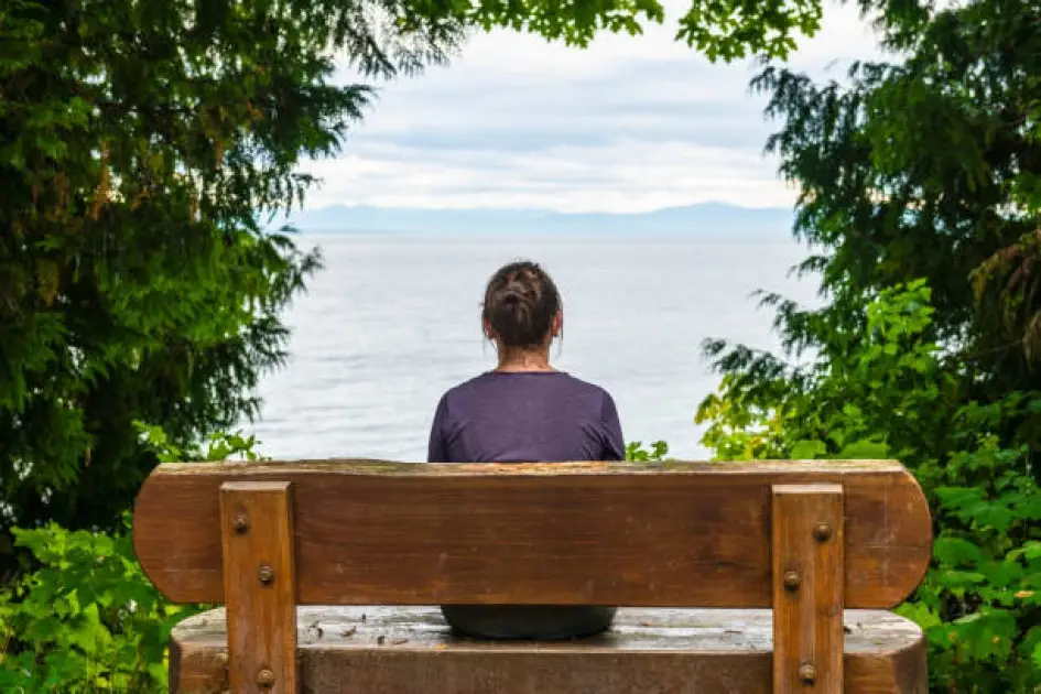 A person sitting calmly in a peaceful environment, reflecting on the importance of mental health as part of a balanced healthy lifestyle.