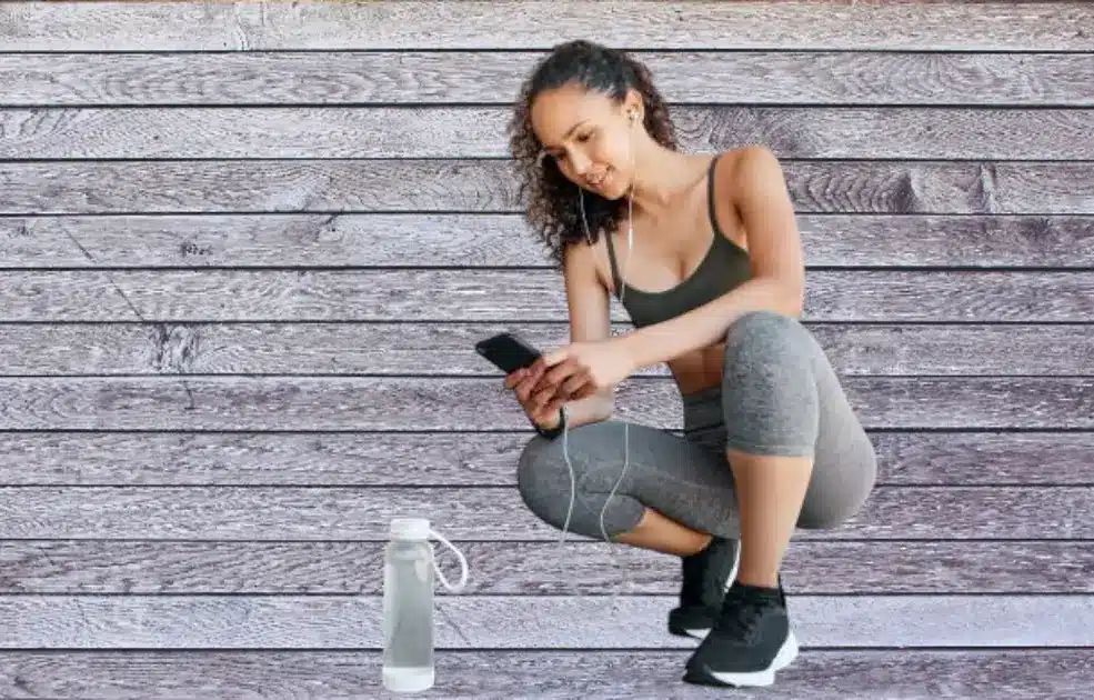 A close-up of a water bottle beside a resting patient, symbolizing hydration during recovery.