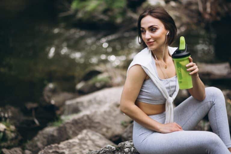 A person drinking powerful supplements that skyrocket energy, vitality, and wellness.