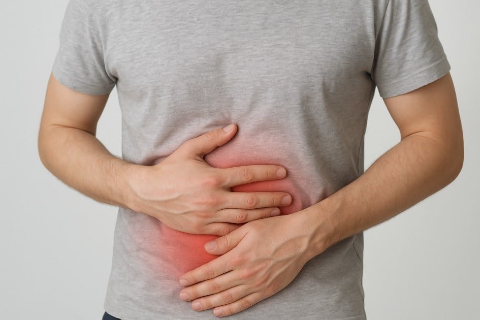 Person holding stomach to show persistent digestive troubles and discomfort
