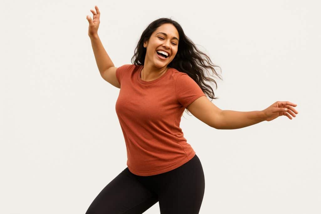Joyful woman dancing outdoors, embracing movement for health and happiness