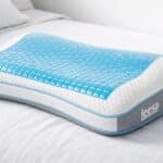 Close-up of Leesa Ultra Cool Memory Foam Pillow on a bed, highlighting cooling gel and ergonomic design.