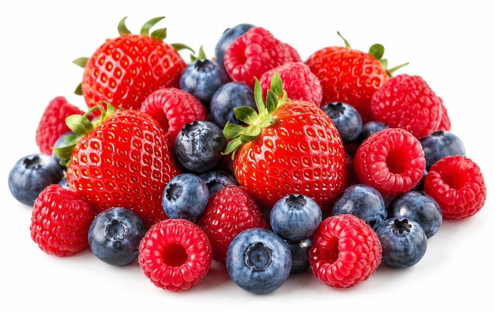 Fresh blueberries, strawberries, and raspberries arranged together as a colorful mix of nutrient-rich berries.
